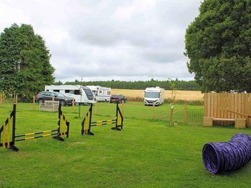 Dog park with dog agility equipment for use by campers and their dogs (added by manager 26 apr 2024)
