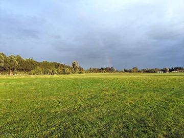 Open field with plenty of room for a kick about or to fly a kite (added by manager 18 aug 2021)