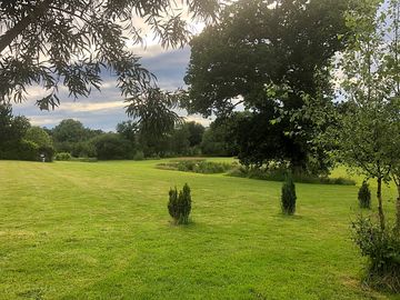Photo of the campsite area looking toward the river and pond (added by manager 25 jun 2021)