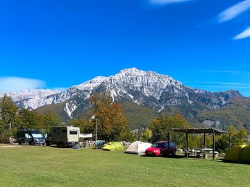 Grass pitch with campervans and tents (added by manager 10 oct 2022)