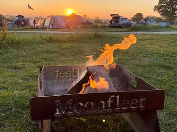 The setting sun from our pitch with our moonfleet firepit! (added by claire_j269924 25 jun 2023)