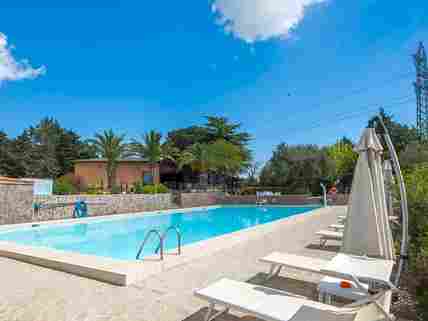 Swimming pool with sun loungers and umbrellas (added by manager 24 May 2017)