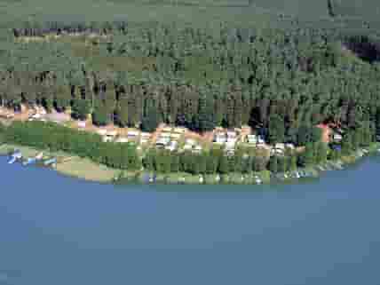 Aerial view of the site's lakeside setting