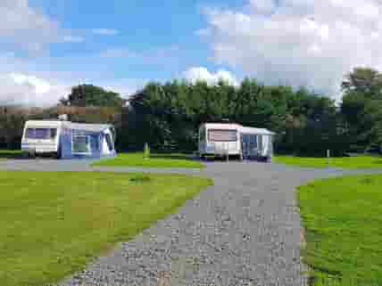 Spacious touring pitches with lake views