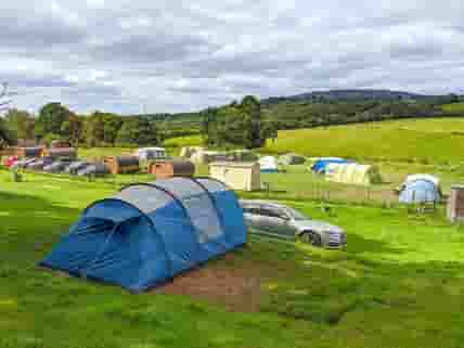 Visitor image showing a tent pitch overlooking the site (added by manager 31 Aug 2022)