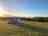 Purbeck Valley Farmhouse: Beautiful sunset over camp site field 