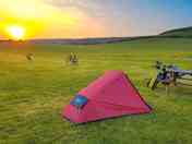 Visitor image of a sunset at the campsite, with lots of bikepackers staying (added by manager 07 Sep 2022)