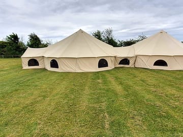 Apartment tent is three bell tents linked toegther
