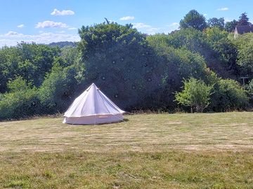 Bell tent in a green field