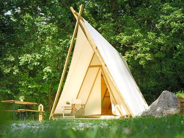 Tipi with picnic seating outside