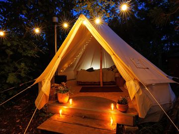 Bell tent with outdoor lighting