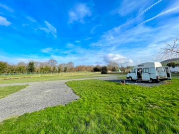 Motorhome pitches with facing away from the road.