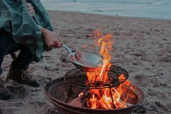 Cook outdoors on your own equipment (Toa Heftiba/Unsplash)