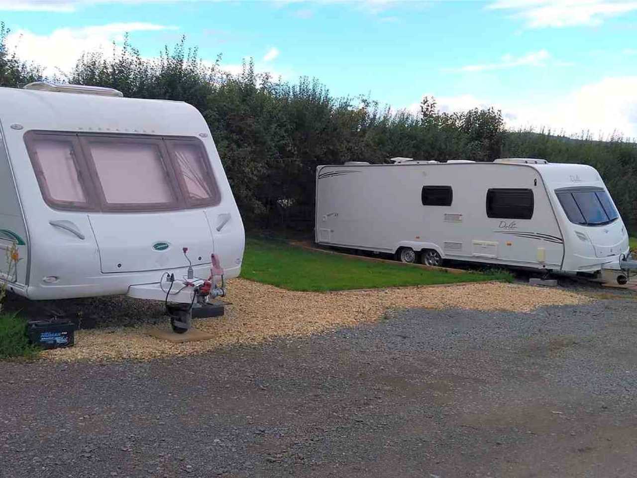 View of parked caravan with hitch at the front