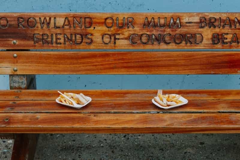 Watch the seagulls don’t swoop – fish and chips on a bench at Canvey Island (Alistair MacRobert on Unsplash)