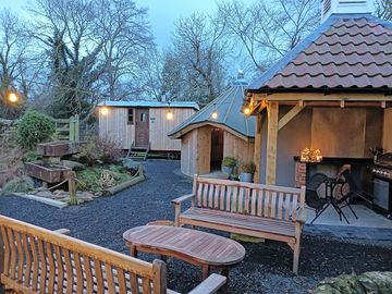 Shared gas bbq area and round house whereabouts the fire pit for you all have a lovely evening.
