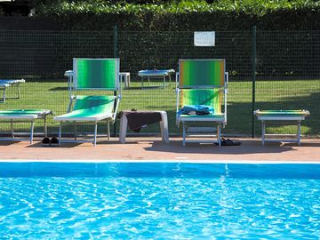 Outdoor pool and sun loungers