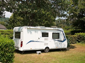 Our spacious pitches are separated by high hedges.