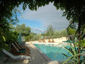 Pool with deckchairs