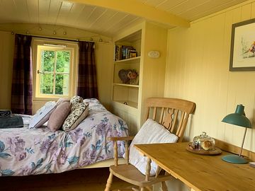 Comfortable double bed, fold-down dining table with two carver chairs