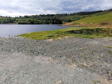 Our camper van pitch located just a stones through from our lake, swim and paddle to your hearts