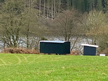 The huts sit on the lochside
