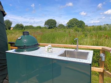 An outdoor kitchen with sink for washing up (added by manager 14 jul 2023)