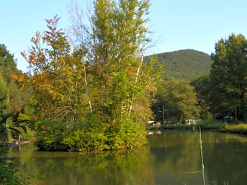 Lake with island and surrounding hills