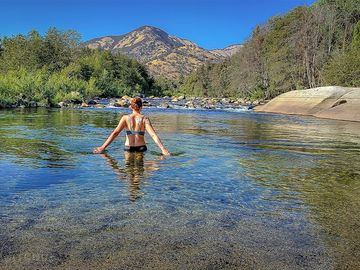 Swimming with a mountain backdrop