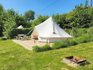 Bell tent with log burner and fire pit