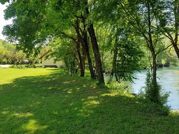 By the river