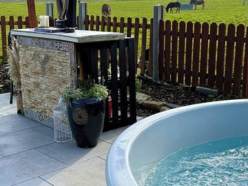 Private bar and hot tub with views of the surrounding rescue farm