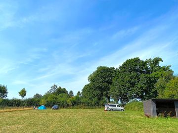 Grass camping field with field shelter