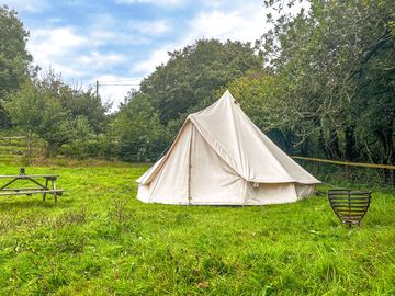 Bell tent on the lower terrace with its own picnic bench and fire pit