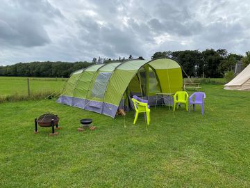 Pre-pitched tent sleeping four, with camp beds and a table and chairs (added by manager 12 mar 2022)