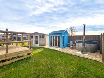 Poppy with her separate kitchen and private raised deck with hot tub