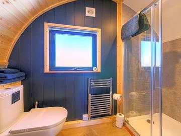 The bathroom of the unit with shower,toilet and sink