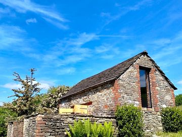 The beautiful chicken house building with a stone peg tile roof