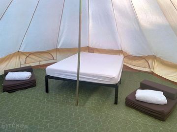 Inside part-furnished bell tent