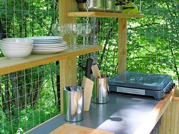 Cooking station adjacent to the bell tent