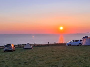 Sunset over wild coastal camping site (added by rupert_p374669 02 sep 2021)