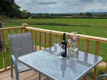 Seating on the decking and rural views