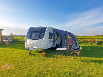 Caravan pitch with added awning