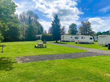 Spacious hardstanding pitch with room for an awning on grass and car parking space (added by manager 04 apr 2023)