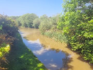 View of the canal towpath from elkington bridge