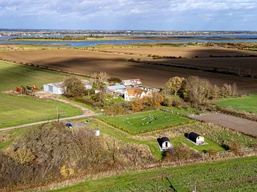 Aerial view of southey creek glamping pods, bramble hall farm and vineyard towards estuary in maldon (added by manager 20 mar 2023)
