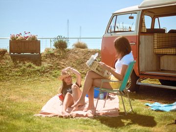 Twelve grass motorhome pitches available next to the marina with water and electric hook-up