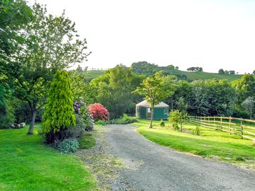 The yurt stands within its own private garden area