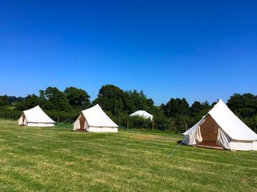 Bell tents pitched in the top field.
