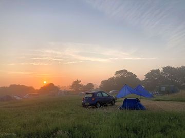 The view across the campsite in the early morning and my neighbour's pitch - idyllic (added by visitor 06 aug 2021)